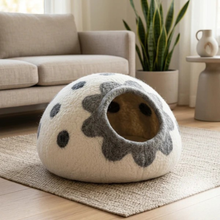 Cat resting inside PawFur lavender wool felt cave bed — cosy and breathable